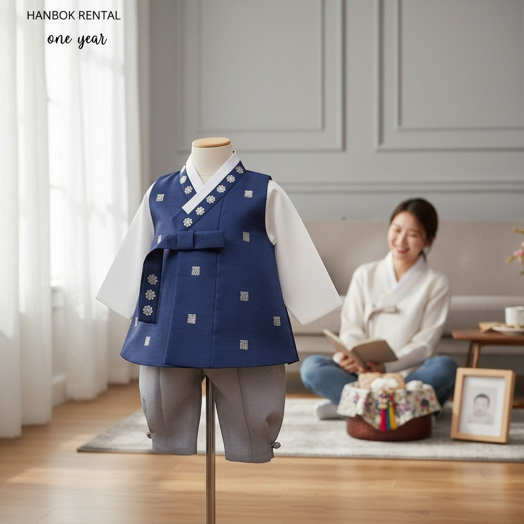 Little Seouls Traditional Korean Baby Hanbok Set: white top, navy vest with silver floral patterns, grey pants. For special occasions.