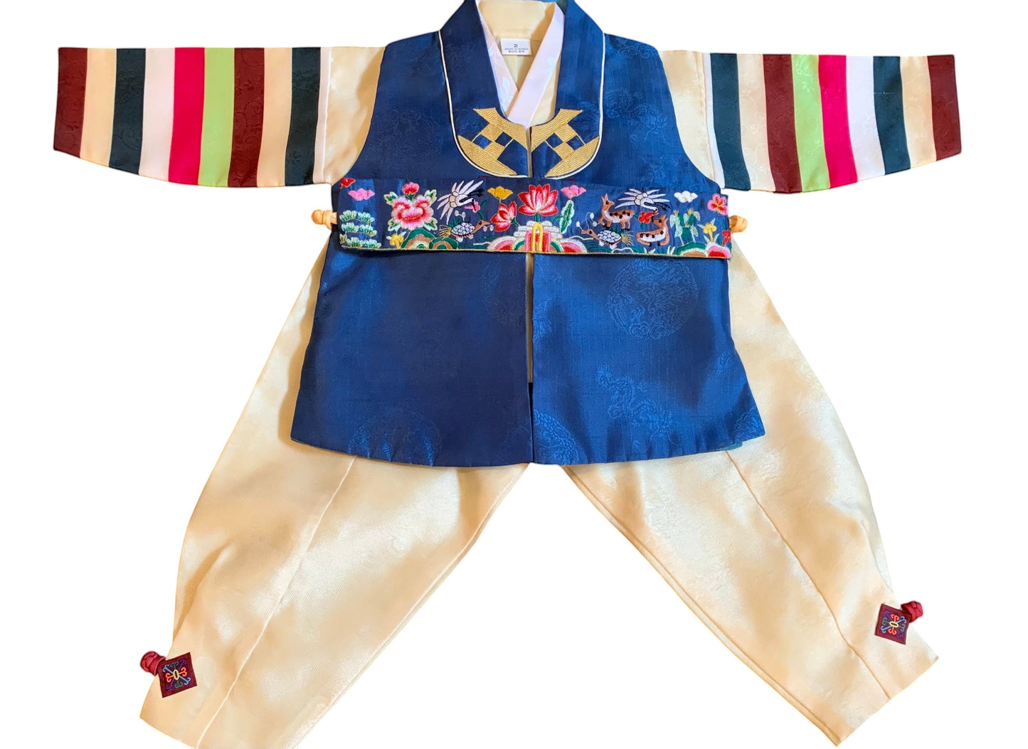 Little Seouls traditional blue and yellow silk hanbok for a 1st birthday boy, featuring embroidered animals and flowers on the vest.