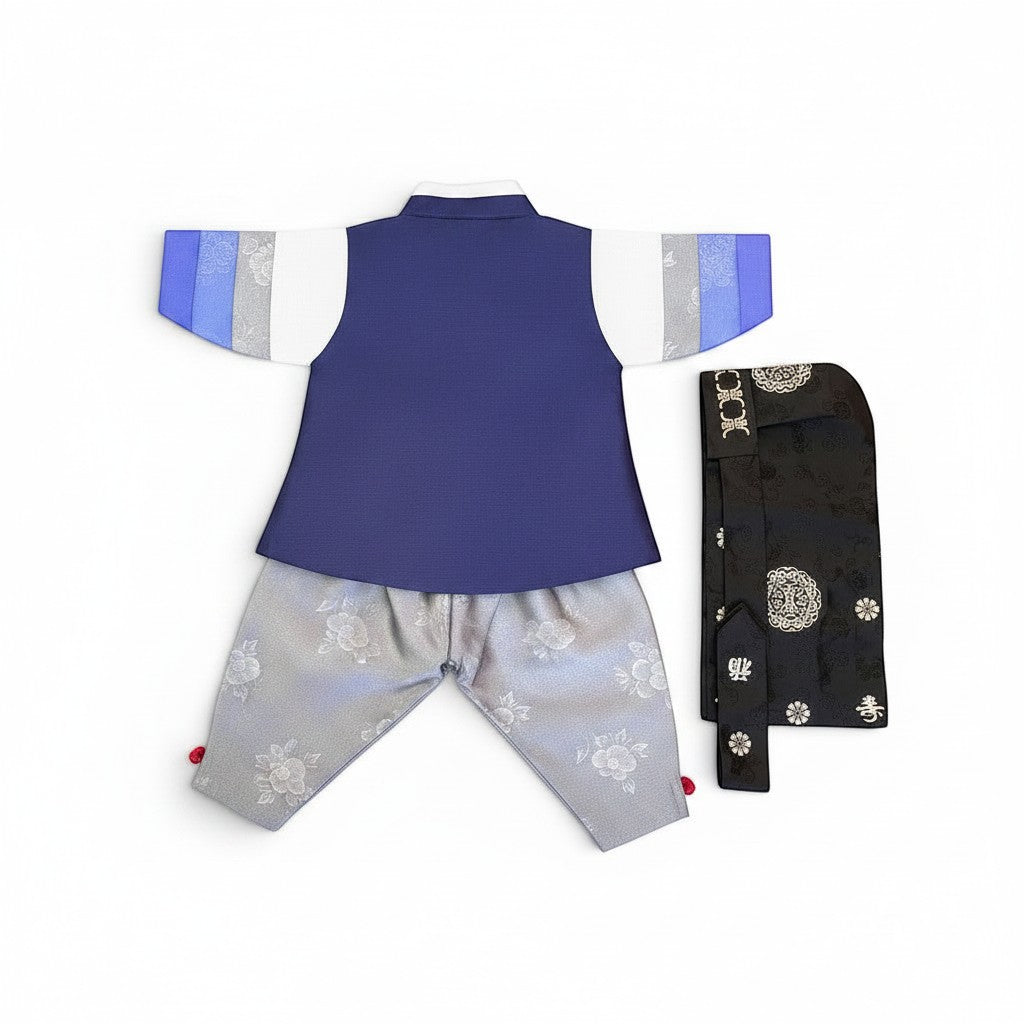 Little Seouls 100th Day Boy Hanbok: blue vest, white shirt with blue & gray sleeves, gray floral pants, and black ornate sash.