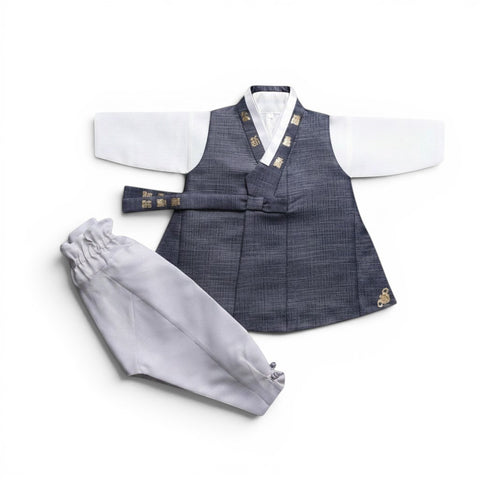 Little Seouls 100th Day boy's hanbok set in charcoal grey with white sleeves and light grey pants, featuring gold embroidery.
