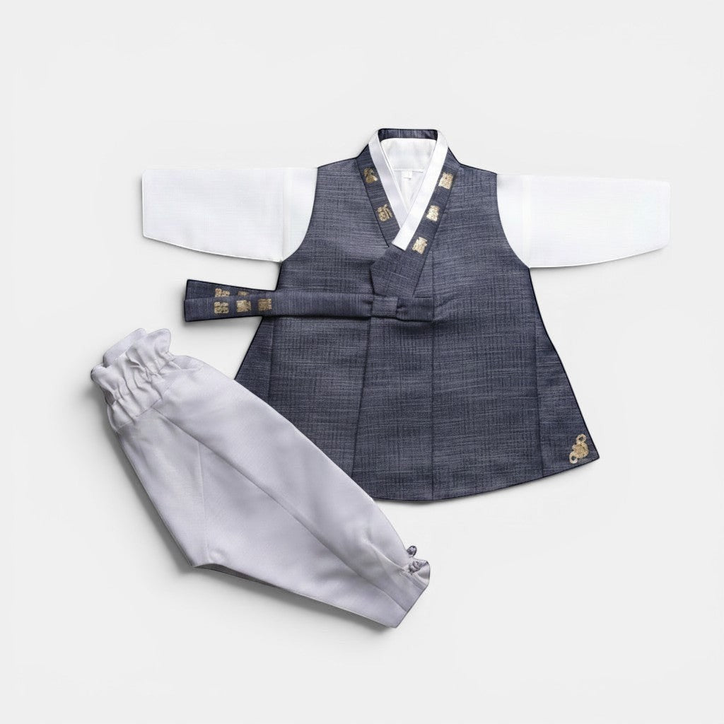 Little Seouls charcoal grey and white 1st birthday boy hanbok with gold embroidery. Includes vest, shirt, pants, and hat.