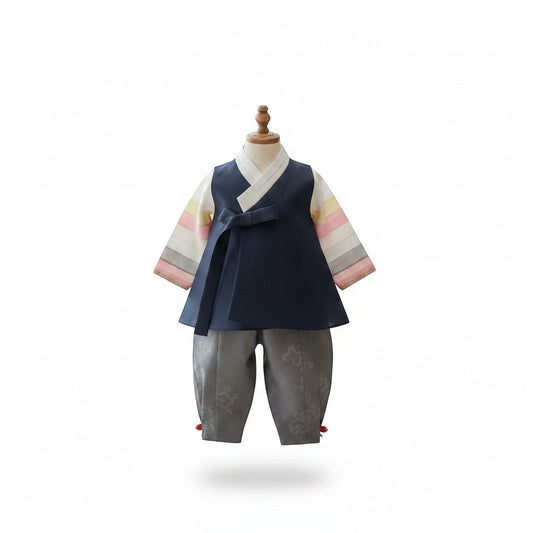 Little Seouls 100th day boy's hanbok set in navy blue, gray, and pastel stripes. Includes vest, shirt, and pants.