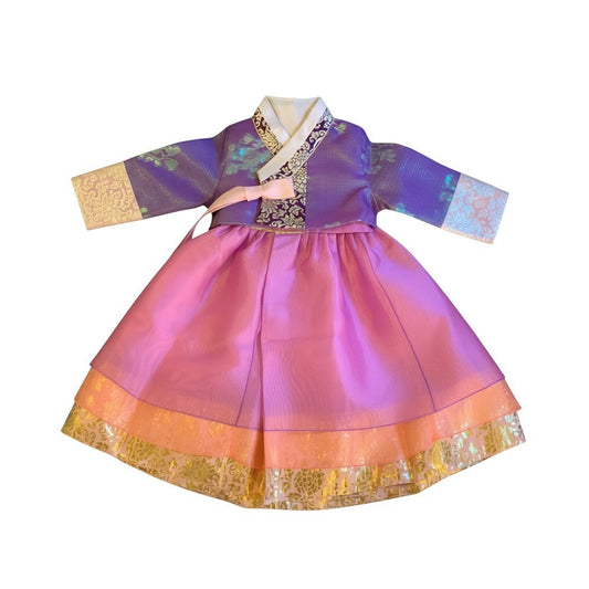 Little Seouls lavender and pink princess hanbok for a 1st birthday girl, featuring ornate gold trim and a pink bow.