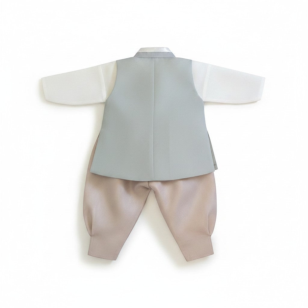 Little Seouls modern Seoul Hanbok for a 1st birthday. Features a light grey vest, white shirt, and beige pants.