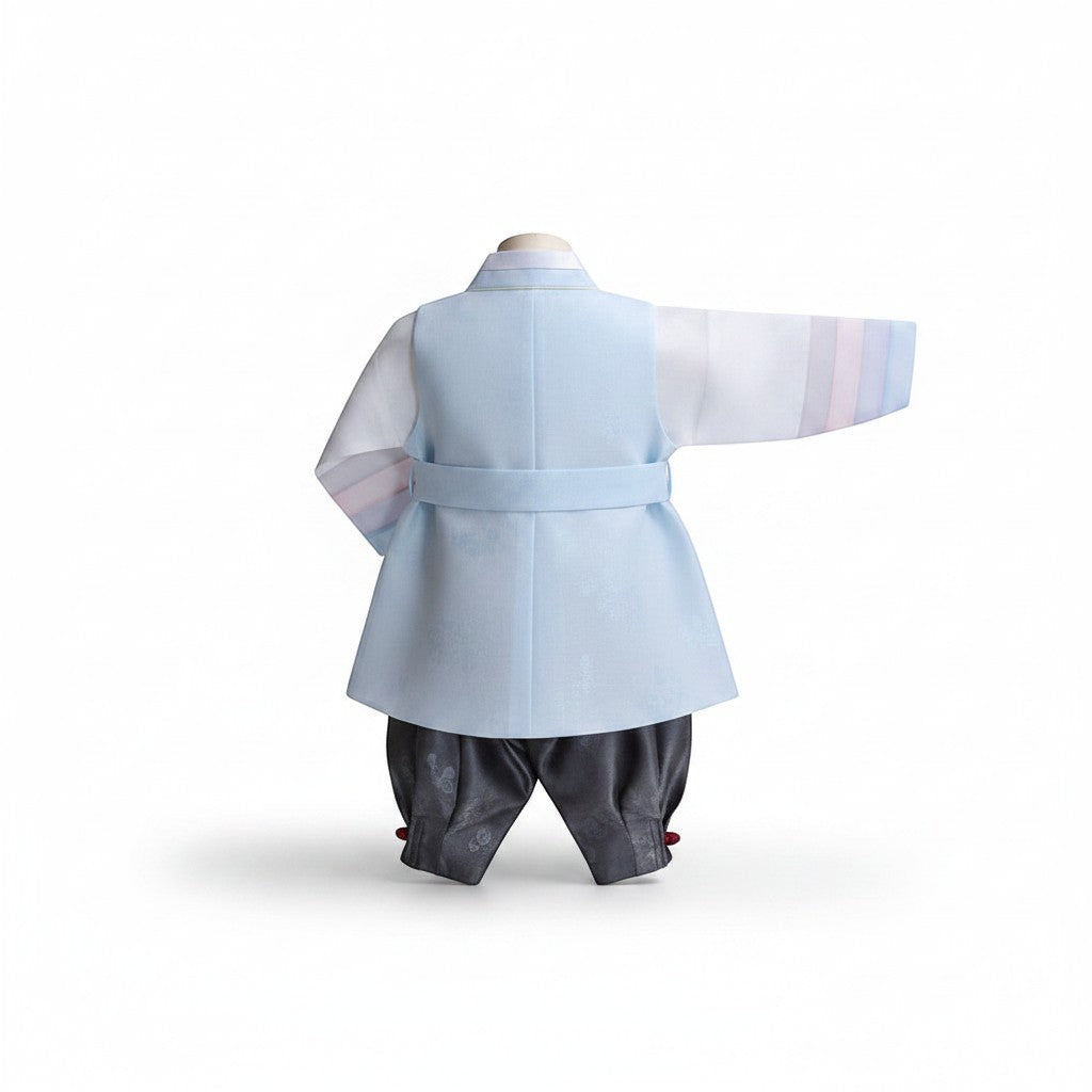 Little Seouls pastel blue and white 1st birthday boy hanbok with grey pants and striped sleeves.