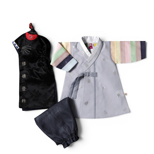 Little Seouls pastel grey hanbok for a 1st birthday boy, with rainbow striped sleeves and matching pants and hat.