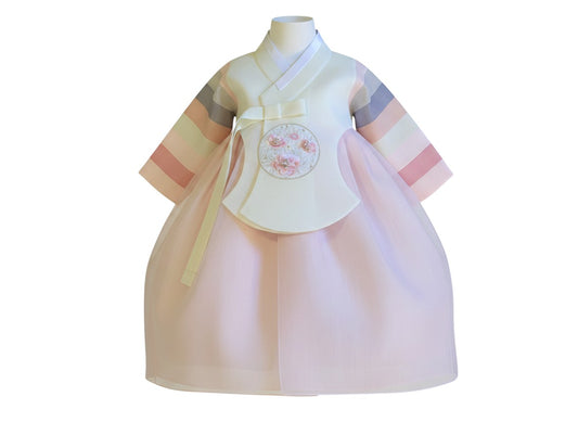Little Seouls pastel light pink princess hanbok for 1st birthday. Features a cream bodice with floral embroidery and a pastel striped sleeve detail.