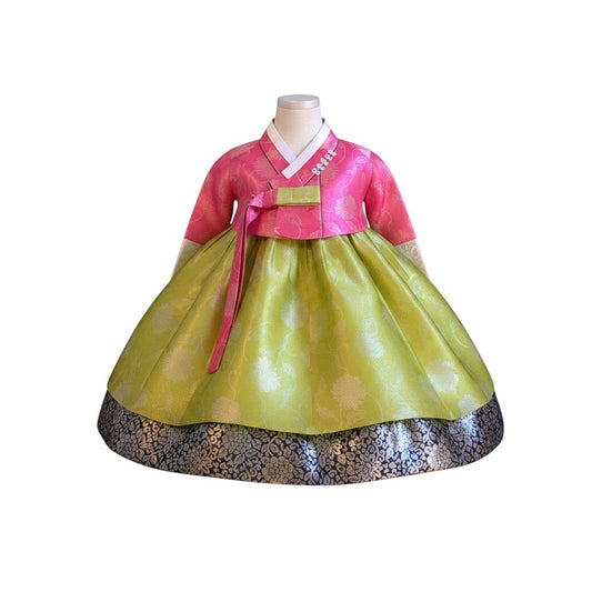 Little Seouls pink and lime green traditional Korean hanbok for a 1st birthday girl, with floral patterns and a black embroidered hem.