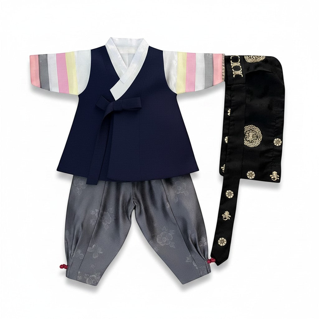 Little Seouls 100th Day boy's hanbok set in navy blue with pastel striped sleeves and gray floral pants.