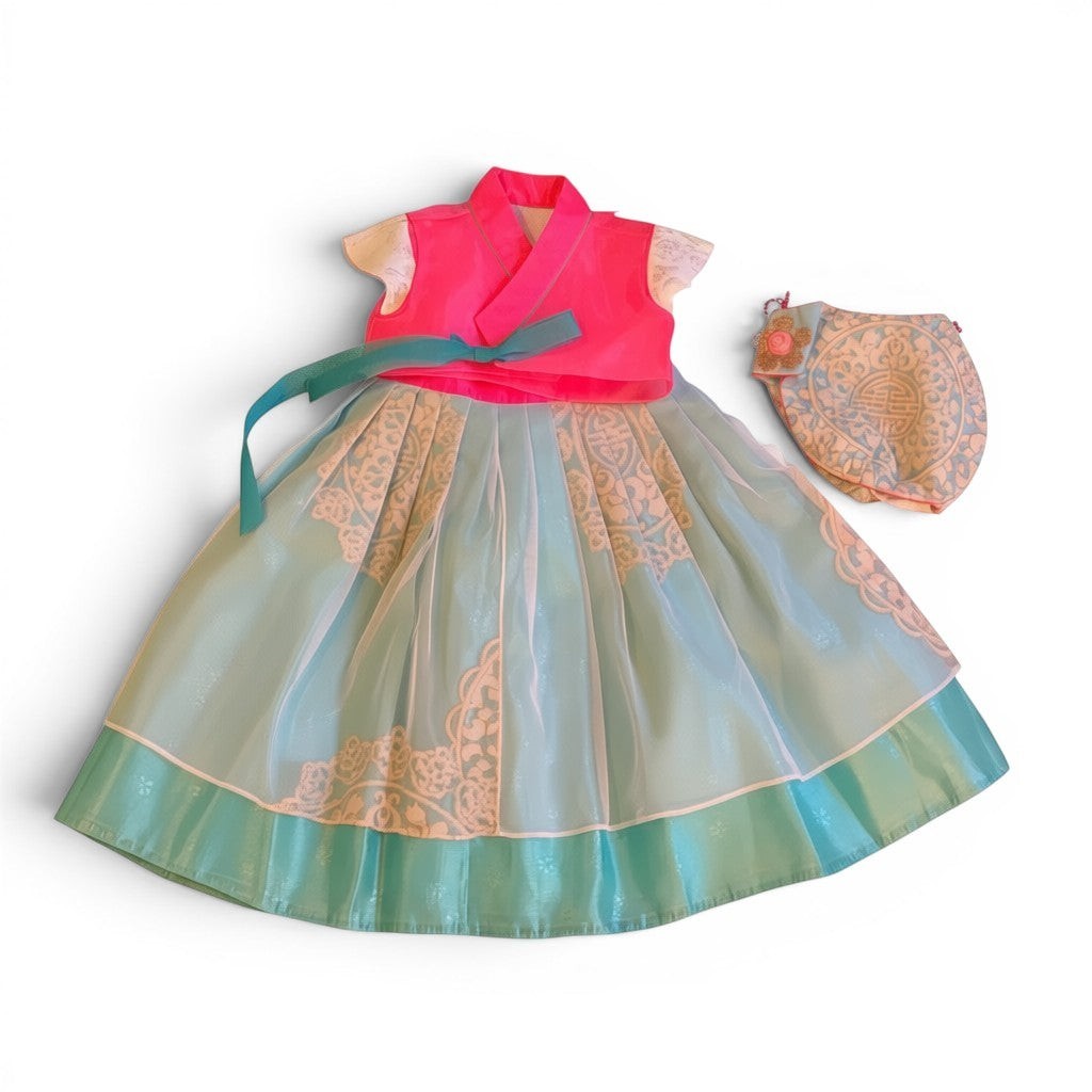 Little Seouls pink and blue fusion hanbok for a 1st birthday girl, featuring a bright pink top and a light blue skirt with white lace details. Includes a matching headpiece.