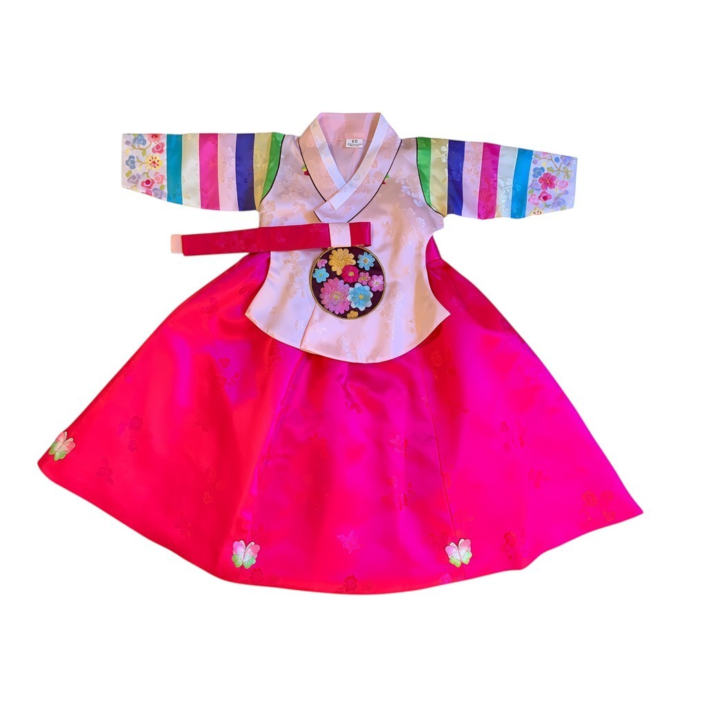 Little Seouls pink and hot pink traditional Korean hanbok for a 1st birthday girl. Features colorful striped sleeves and floral embroidery.