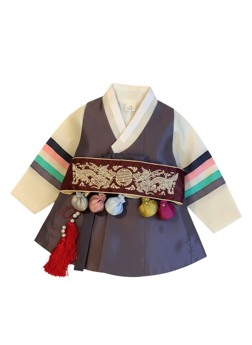 Little Seouls traditional plum and navy boy's 1st birthday Dolbok hanbok with dragon embroidery and colorful tassels.
