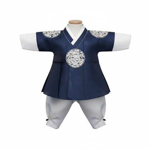 Little Seouls navy blue royal king style hanbok for a 1st birthday boy, with white pants and ornate silver dragon detail.