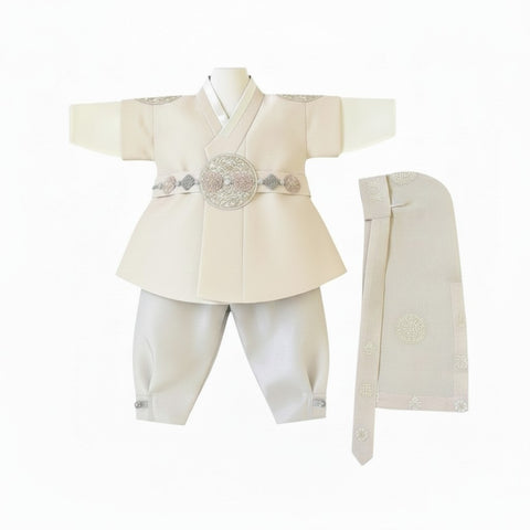 Little Seouls 1st birthday boy taupe hanbok set with embroidered details and ornate belt. Includes shirt, pants, vest, and headpiece.